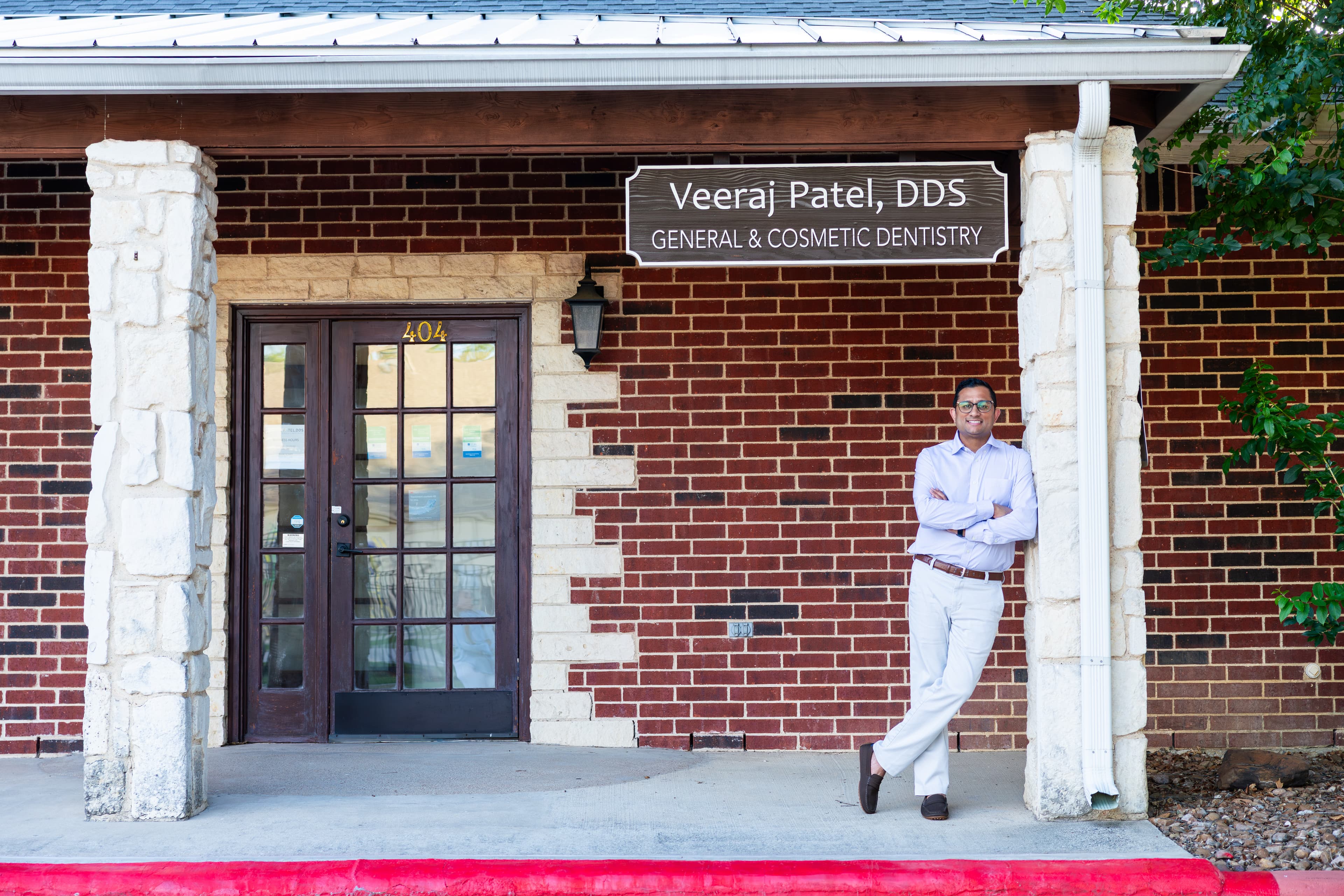 Dr. Veeraj R. Patel, DDS outside his Plano, TX practice